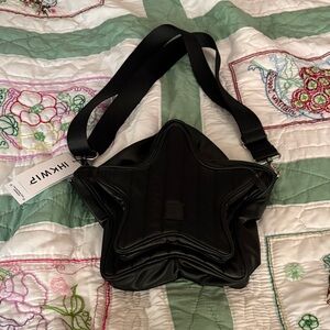 NWT IHKWIP Black shooting star nylon crossbody. Adjustable strap & front pocket.